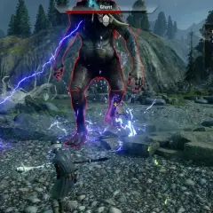 Bitwa z olbrzymem w Dragon Age: Inkwizycja DLC. Gracze walczą z potężnym przeciwnikiem, używając magii i broni.